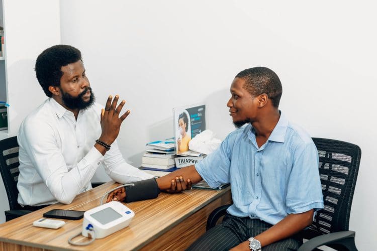 Doctor consulting with patient at hospital in Amuwo Odofin Lagos Nigeria healthcare medical services